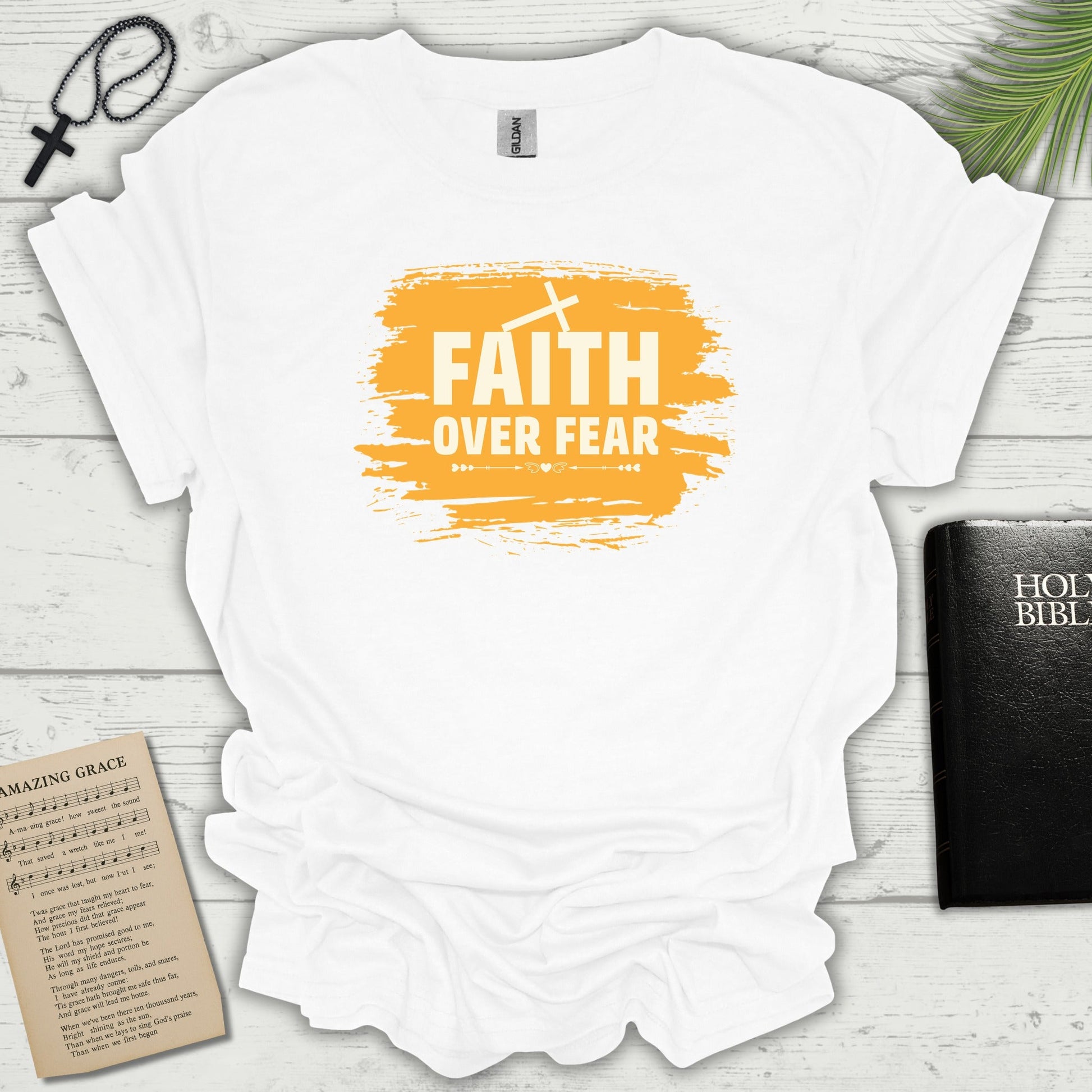 Faith Over Fear orange brush T-shirt flat lay mockup
